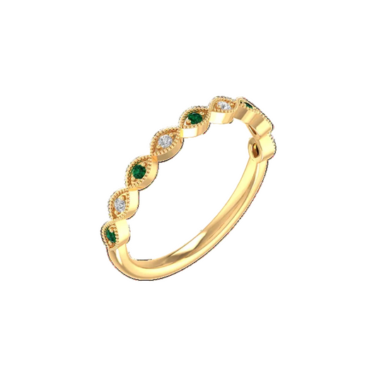 Gold ring with green gemstones on a white background
