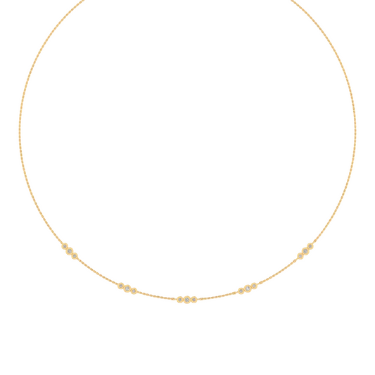 A delicate gold chain necklace with a low curved dip, decorated with small clusters of round-cut clear stones at intervals, shown on a plain white background.