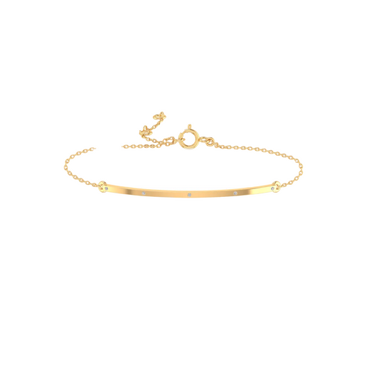 A delicate gold bar bracelet with four small, round clear gemstones set along the center, displayed on a clean white background.