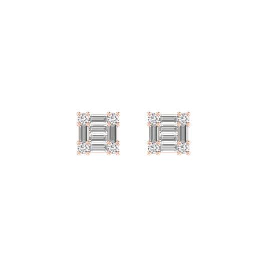 A pair of square stud earrings featuring baguette-cut clear stones in a silver-toned setting with small rose gold accents at the corners, shown on a plain white background.