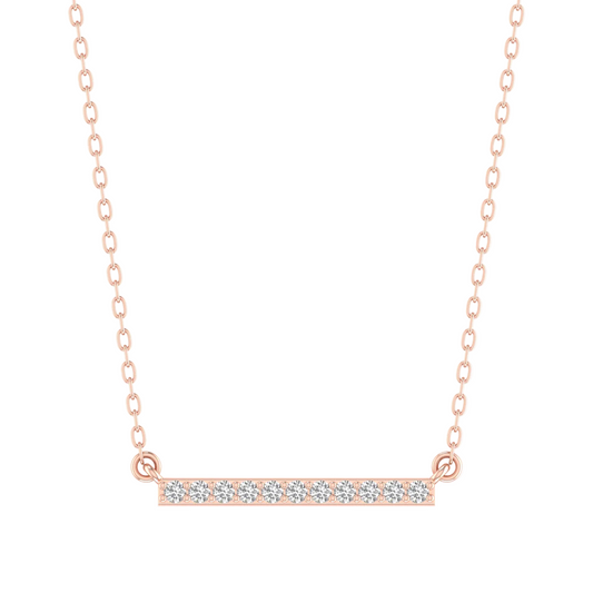 A delicate rose gold bar necklace featuring a horizontal bar pavé-set with small clear stones, suspended from a fine link chain on a solid white background.