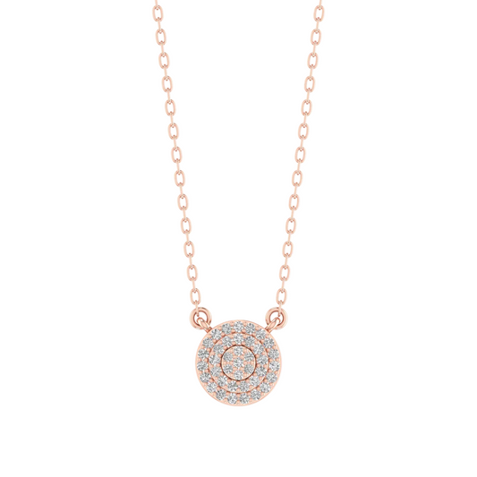 A delicate rose gold chain necklace featuring a circular pendant paved with small clear gemstones, set against a solid white background.