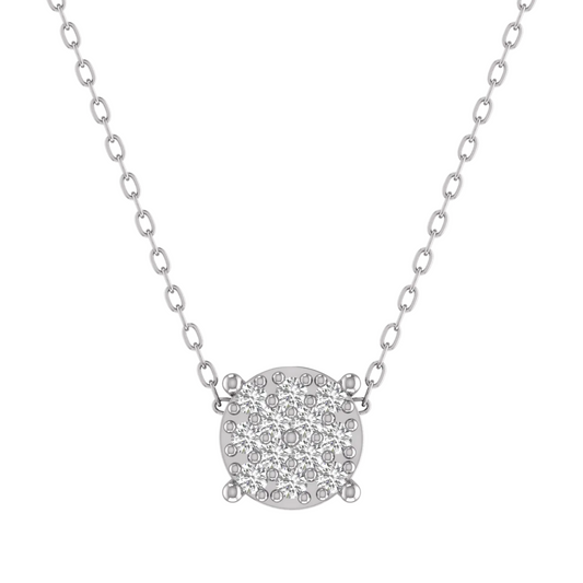 A silver-toned necklace featuring a round pavé pendant with small clear stones, suspended from a delicate link chain against a plain white background.