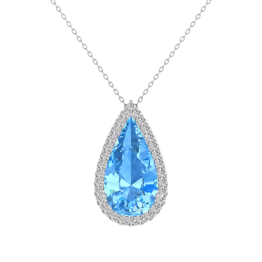 A teardrop-shaped pendant necklace featuring a faceted light blue gemstone surrounded by a halo of small clear stones, suspended from a delicate silver-toned chain on a plain white background.