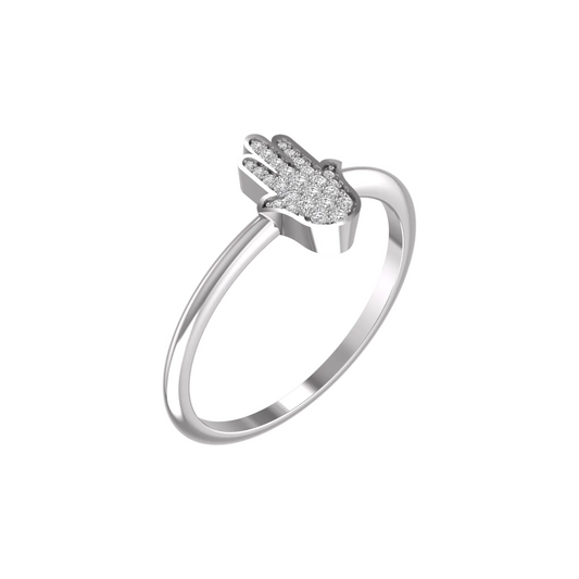 A silver ring featuring a Hamsa hand charm paved with small clear stones, shown on a plain white background.