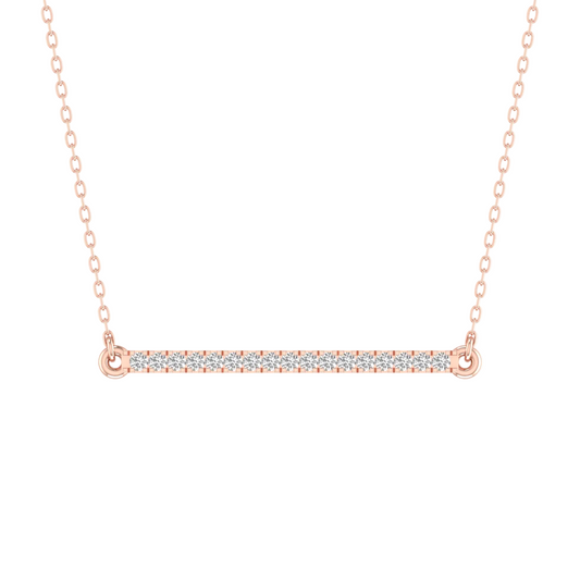 A rose gold bar necklace with a pavé diamond center, suspended from a delicate rose gold chain against a solid white background.